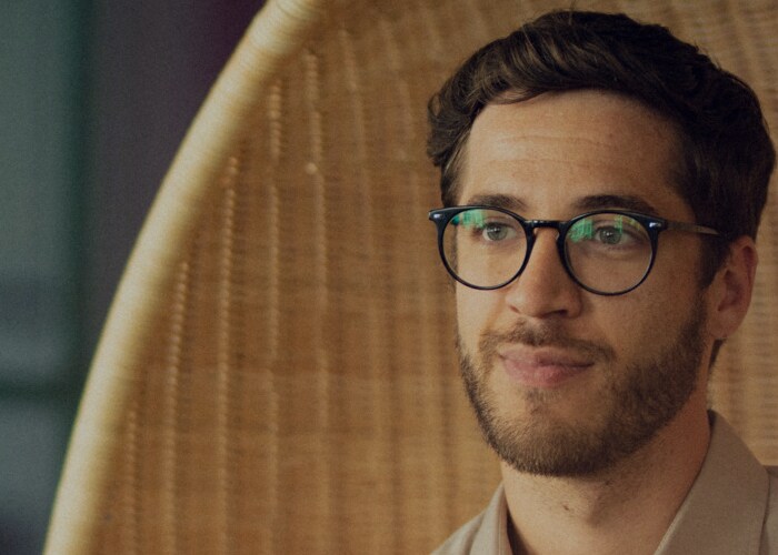 Male employee sit and works.