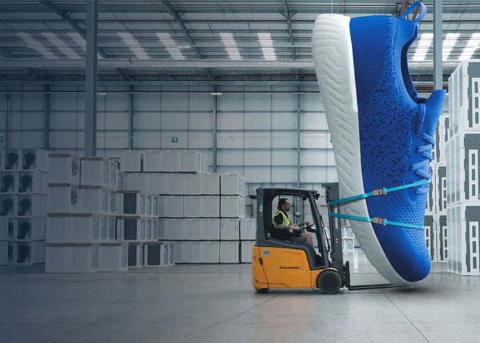 Forklift carrying big shoe