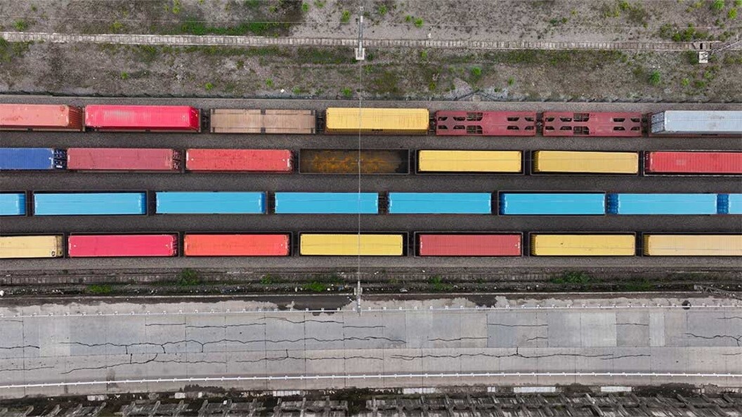 Aerial view of colorful freight train containers.