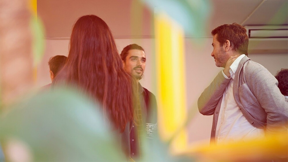 Business owners talking about new customs tariffs and regulations.