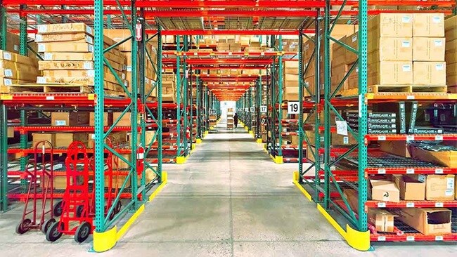 A logistics warehouse filled with shelves and boxes.