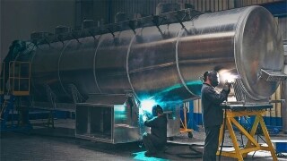 Two male fixing an equipment
