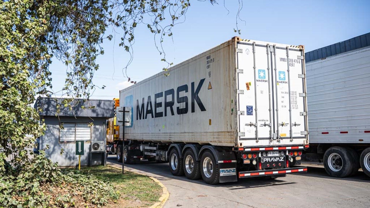 Maersk shipping container truck entering a facility.