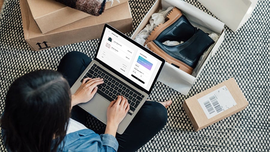 Woman sitting on the floor using laptop