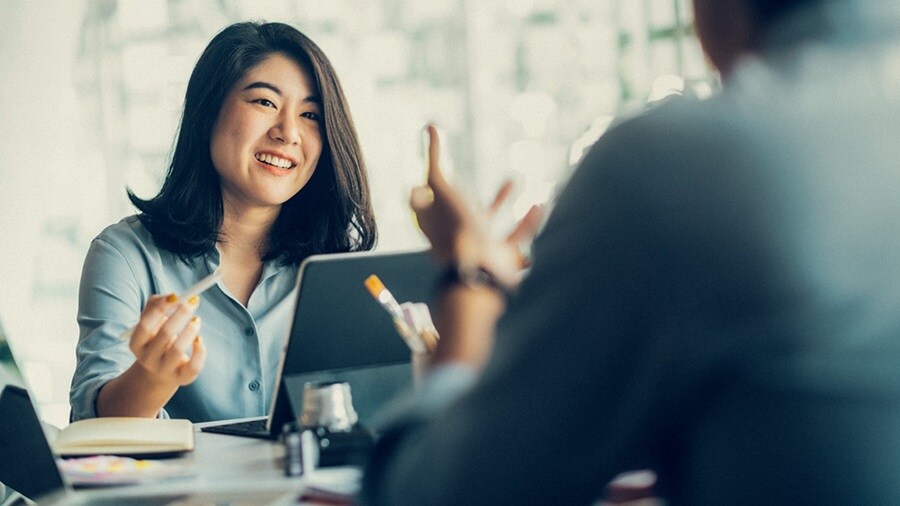 Woman working at laptop in office