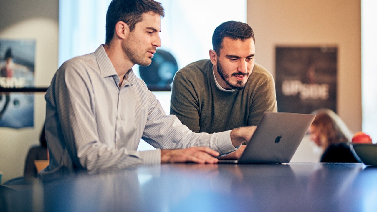 Employees working on a laptop