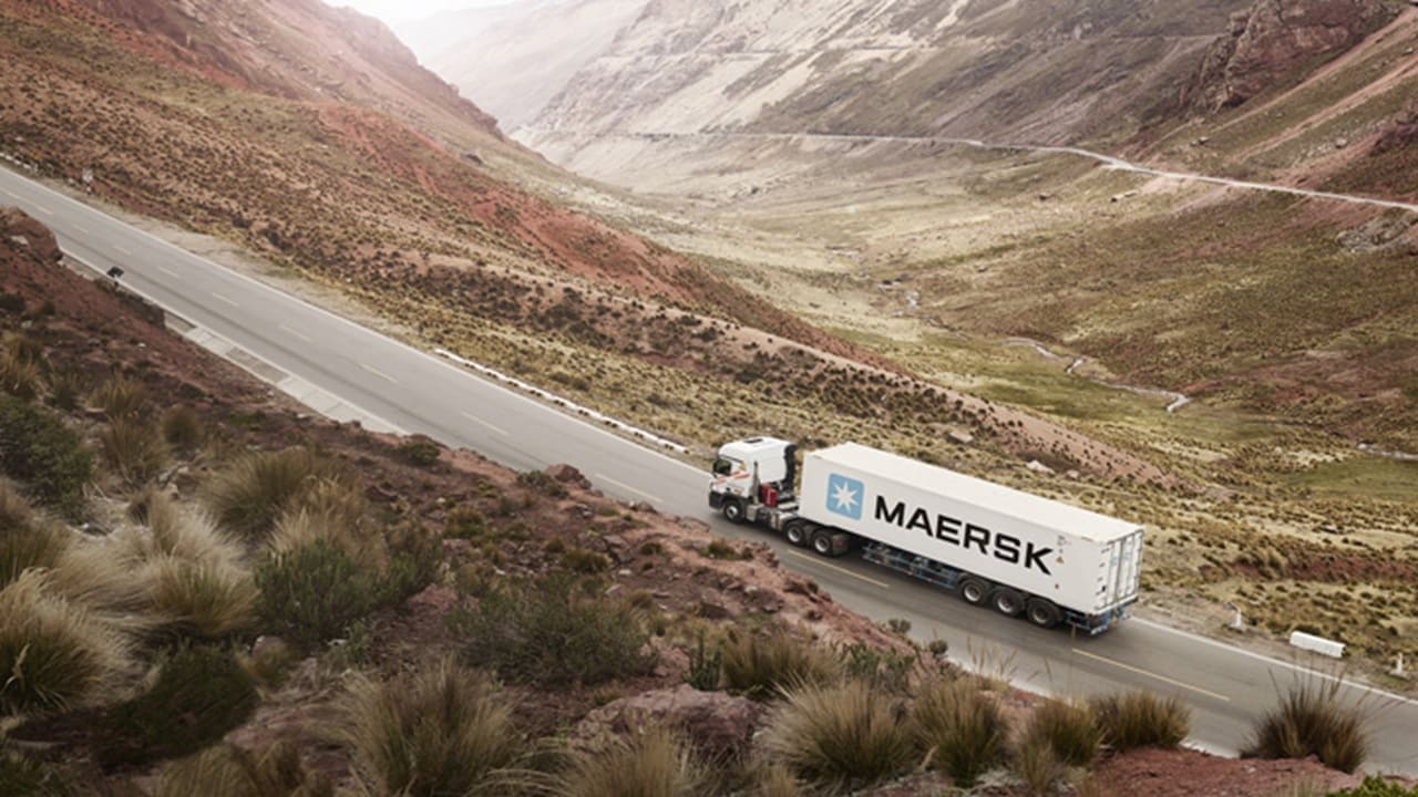 Spot booking - An aerial view of a truck carrying cargo container of Maersk.