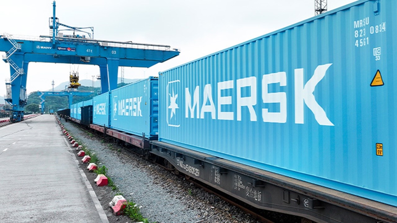 Two male colleagues engaged in an intense face-to-face discussion in a modern office setting, representing deep collaboration and problem-solving